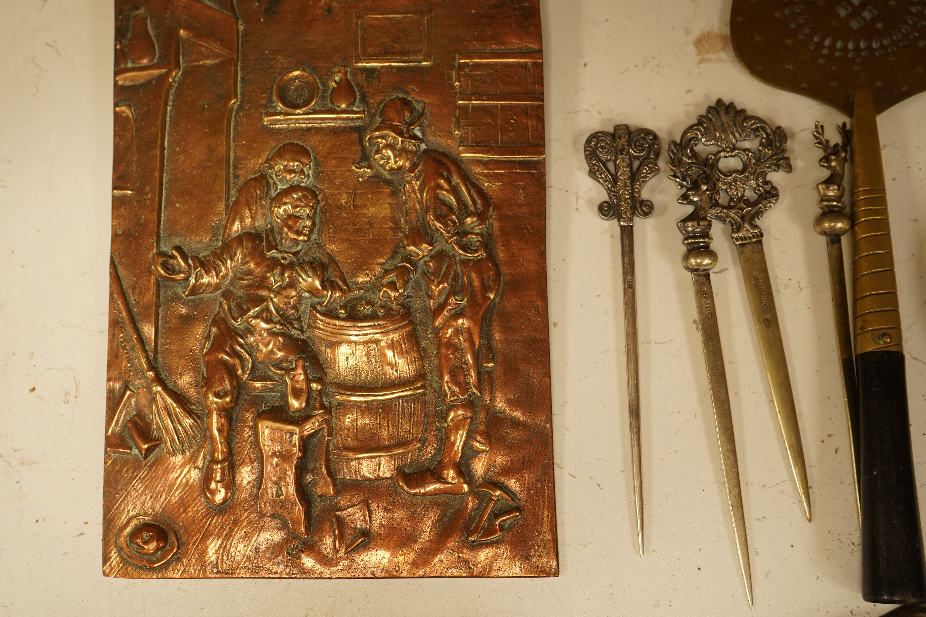 A mixed group of metalware including an Art Nouveau figural dish and pewter dish, a candlestick etc